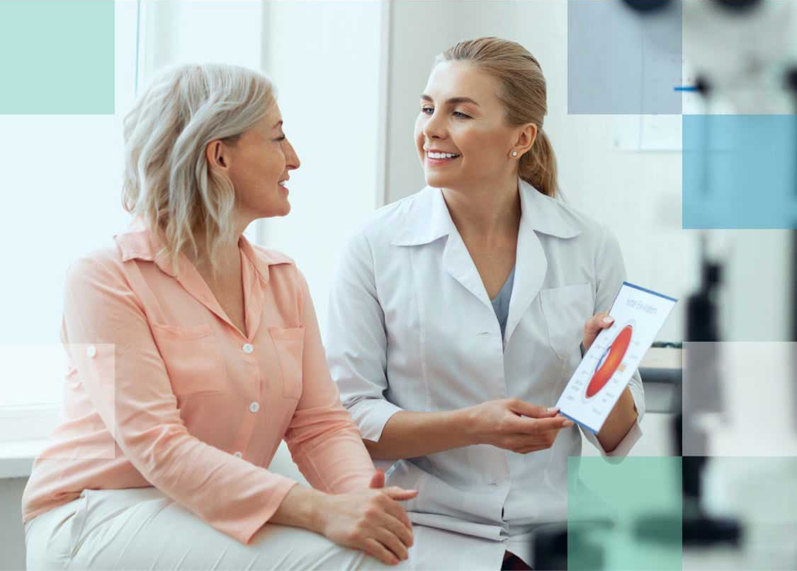 Eye Care Professional talking with patient about the structure of the eye.