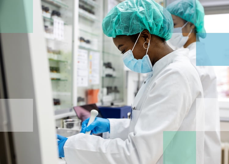 Two eye care scientists working in the lab on Bausch + Lomb High-Def Optic Contact Lenses.