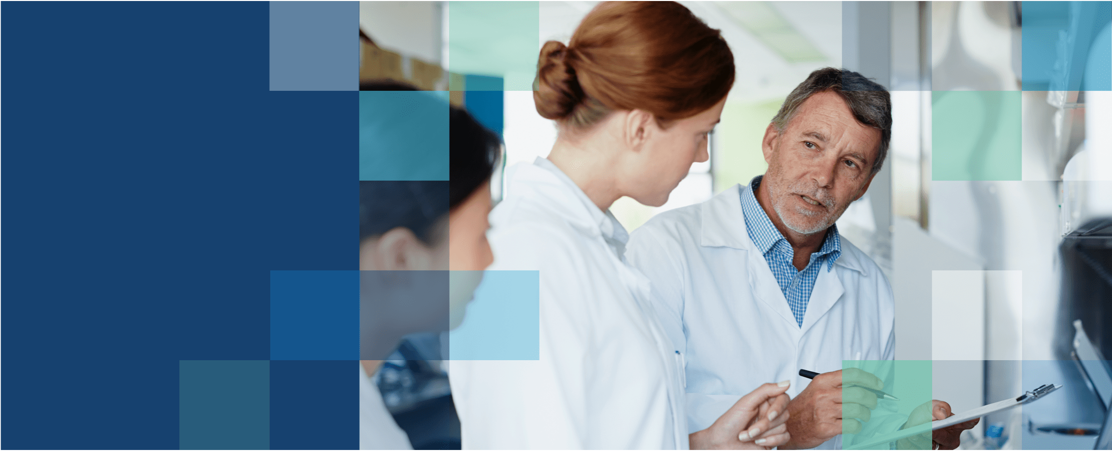 One male and one female eye care professionals discussing vision treatment plan with a female patient.